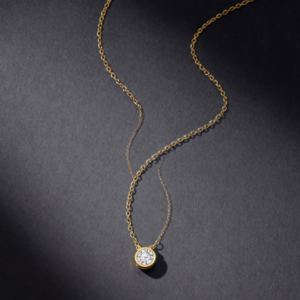 A necklace featuring 0.15-carat lab-grown diamonds bezel-set in 18K gold plated with sterling silver.