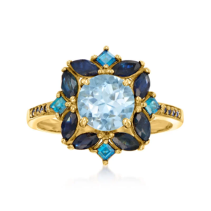 A ring featuring a 1.80-carat sky-blue topaz, a 2.40-carat sapphire, and a 0.80-carat London blue topaz, crafted in 18K gold and plated with sterling silver.