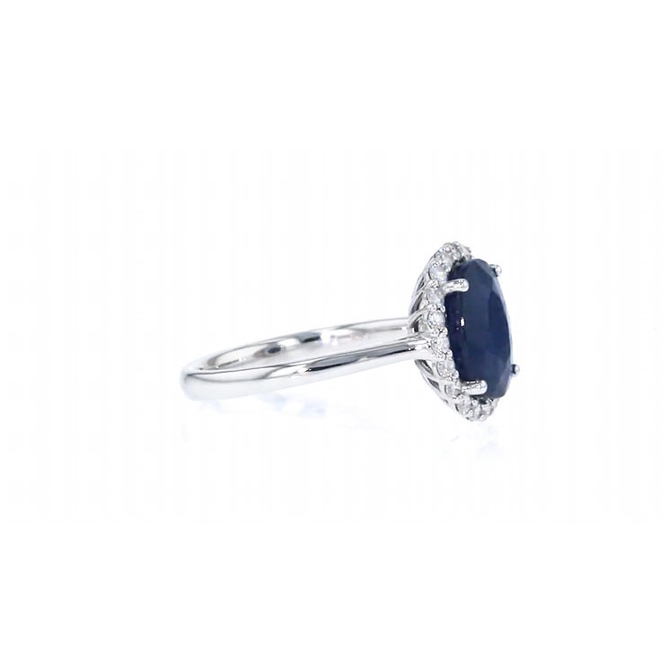 A halo ring featuring a 3.60-carat sapphire and 0.35-carat diamonds in 14K white gold. - Image 4